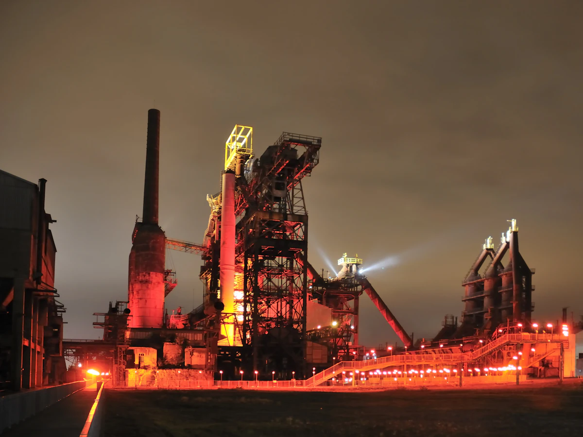 Steel and power plant at night — PTZ and explosion-proof CCTV for industrial plants